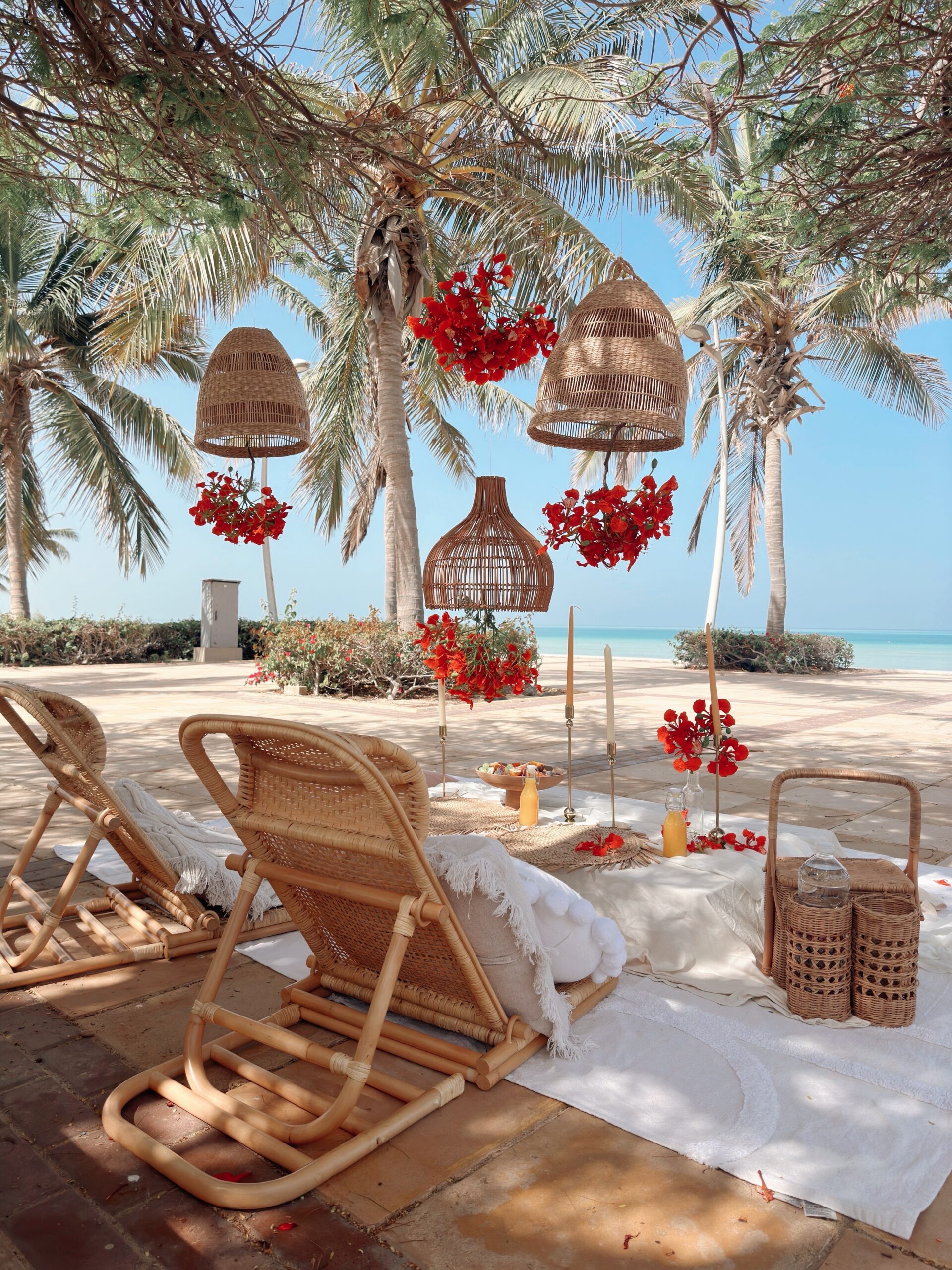 Home Beachside event styling with palm trees and hanging natural decor